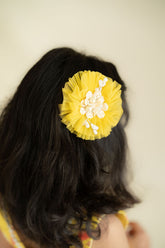 Yellow circular hair accessory
